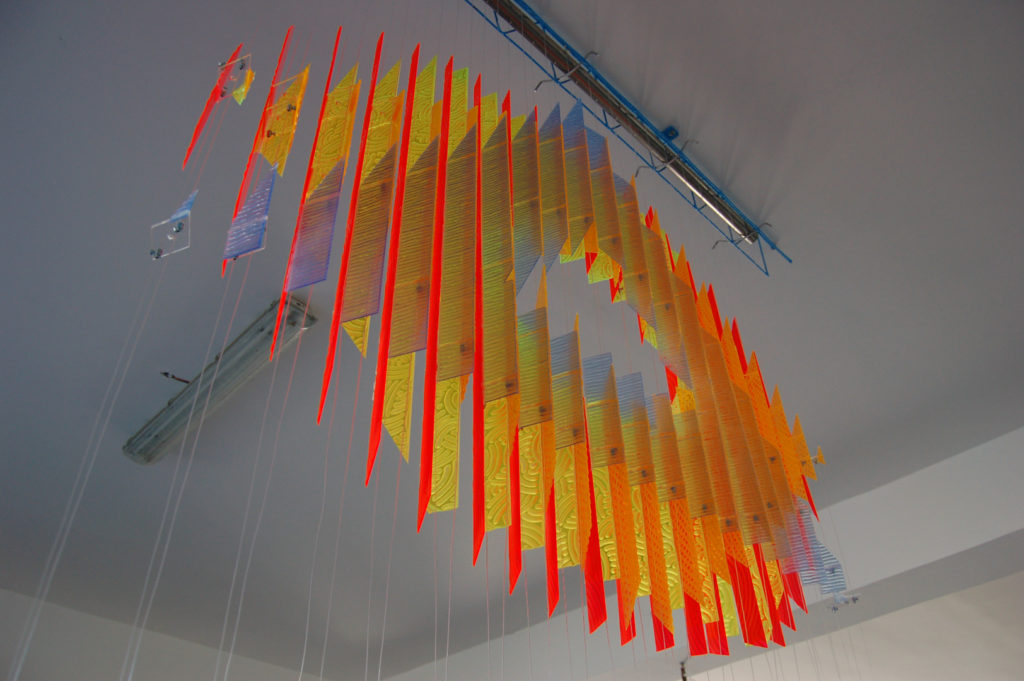 anamorphic, shape shifting, sculpture, acrylic, carved, coloured, geometric, abstract, Aspinall, art, rainbow, suspended