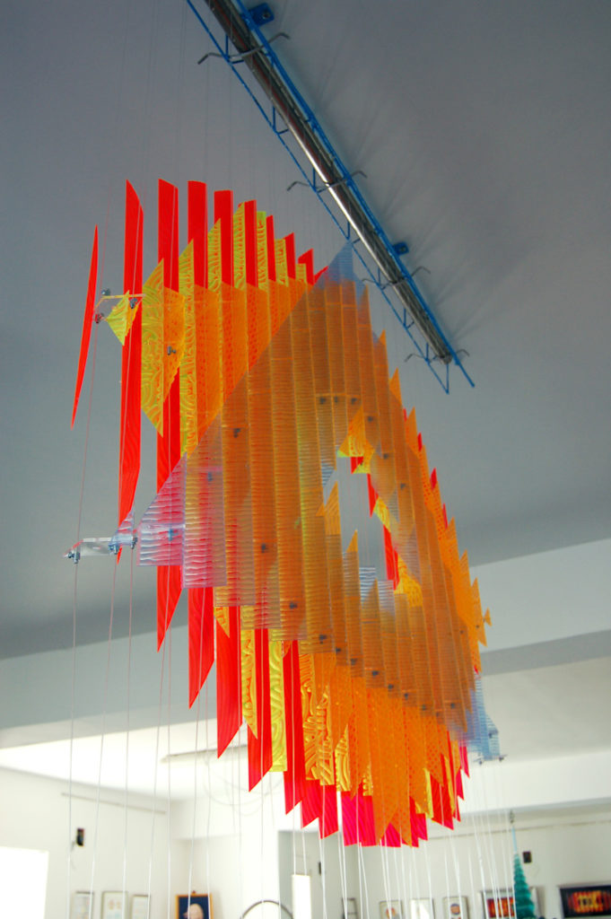 anamorphic, shape shifting, sculpture, acrylic, carved, coloured, geometric, abstract, Aspinall, art, rainbow, suspended